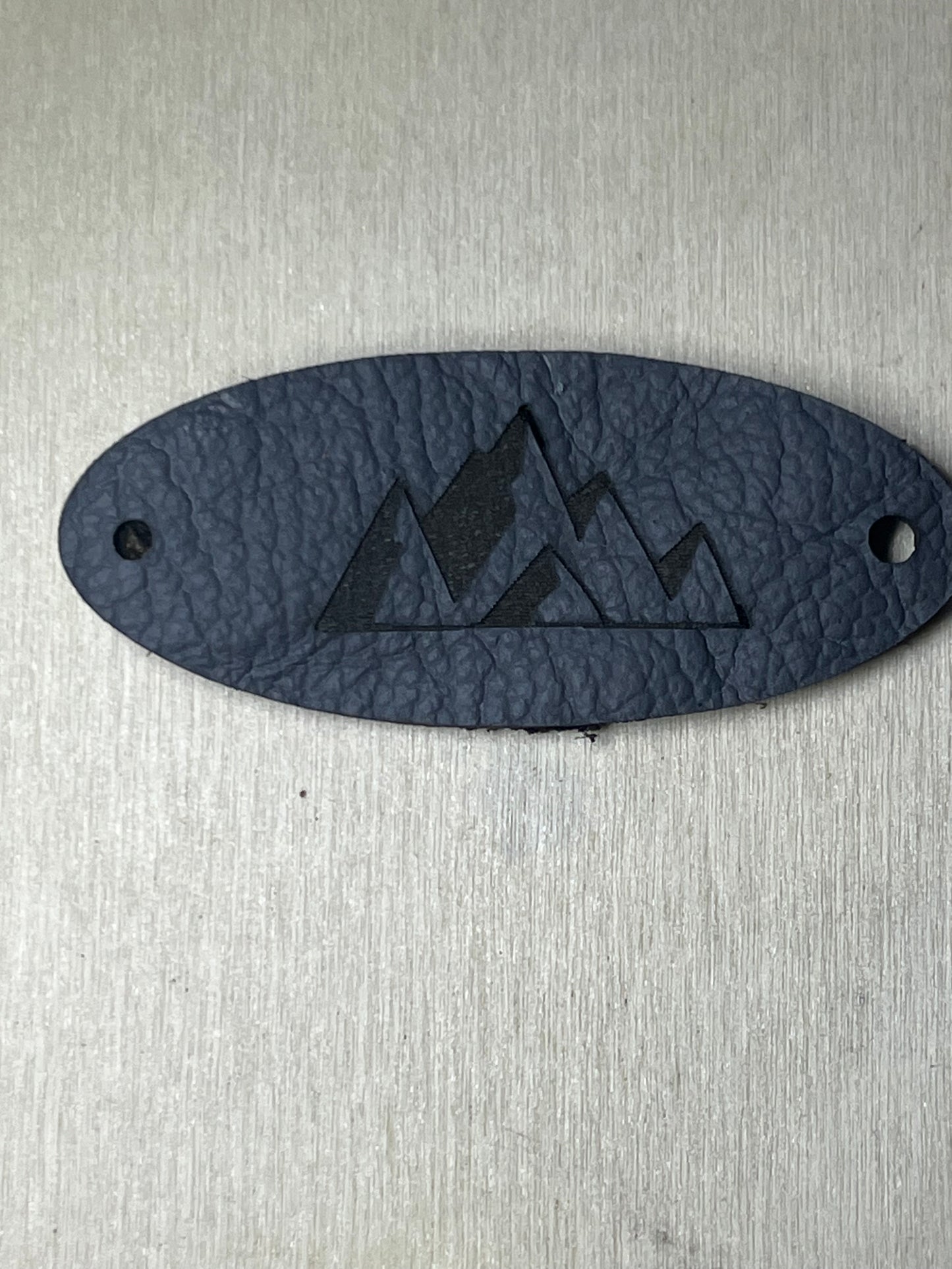 3" Oval Tag with two rivet holes - Mountains