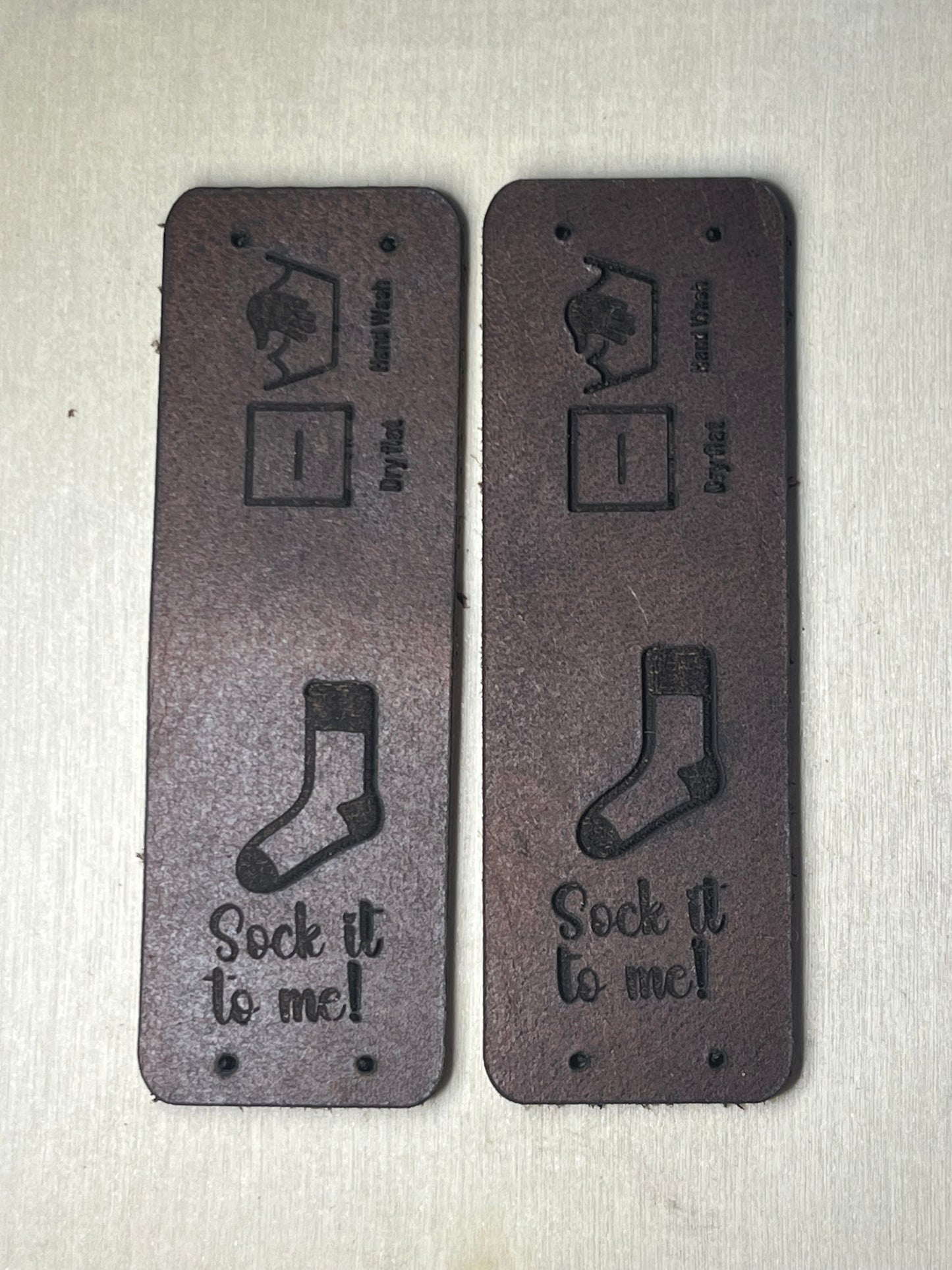 Set of 2 - 1"x3" rounded Fold over rectangle Leather Tag - Sock it to me!