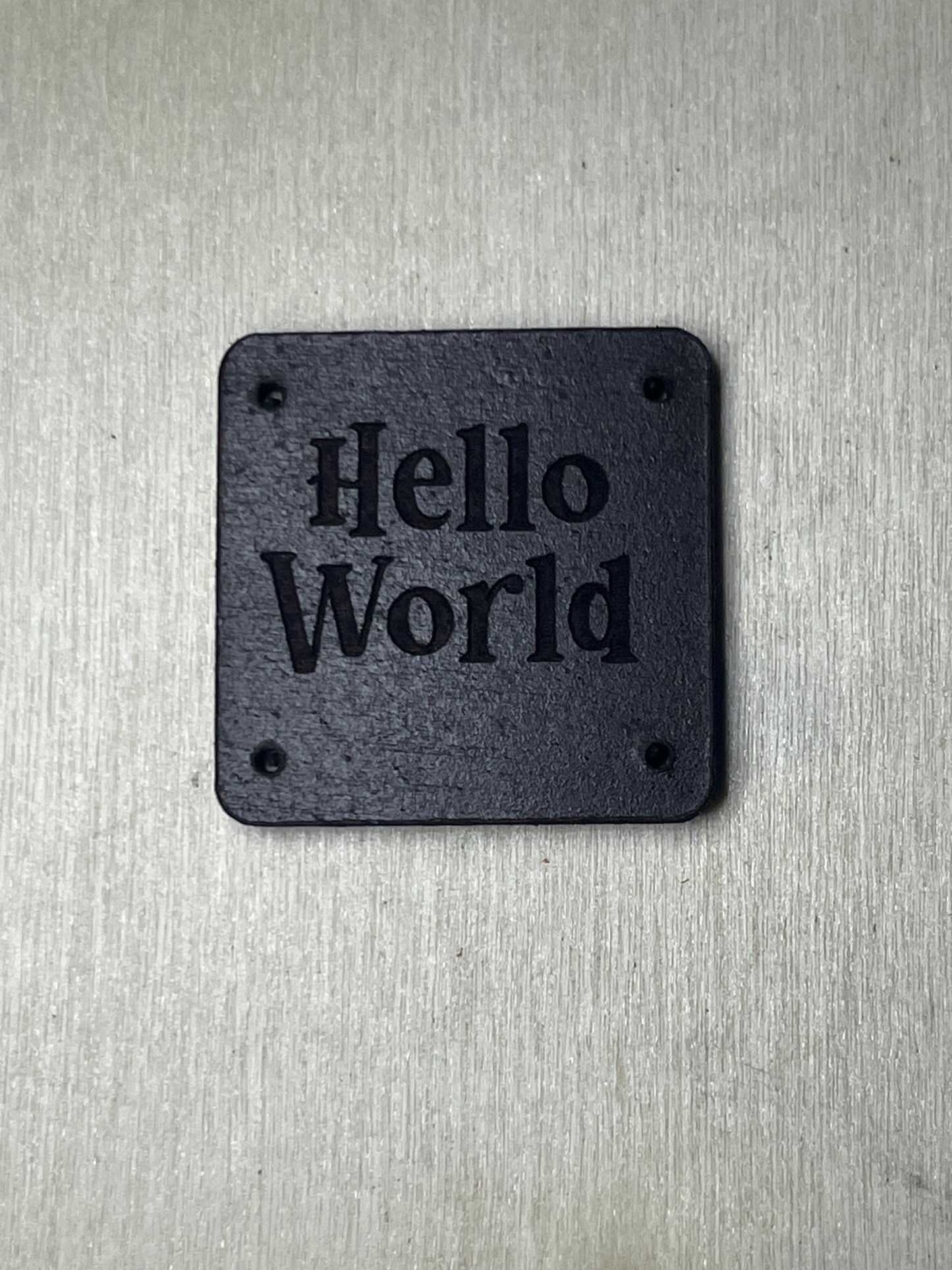 1"x1" rounded square with 4 side holes- Hello World